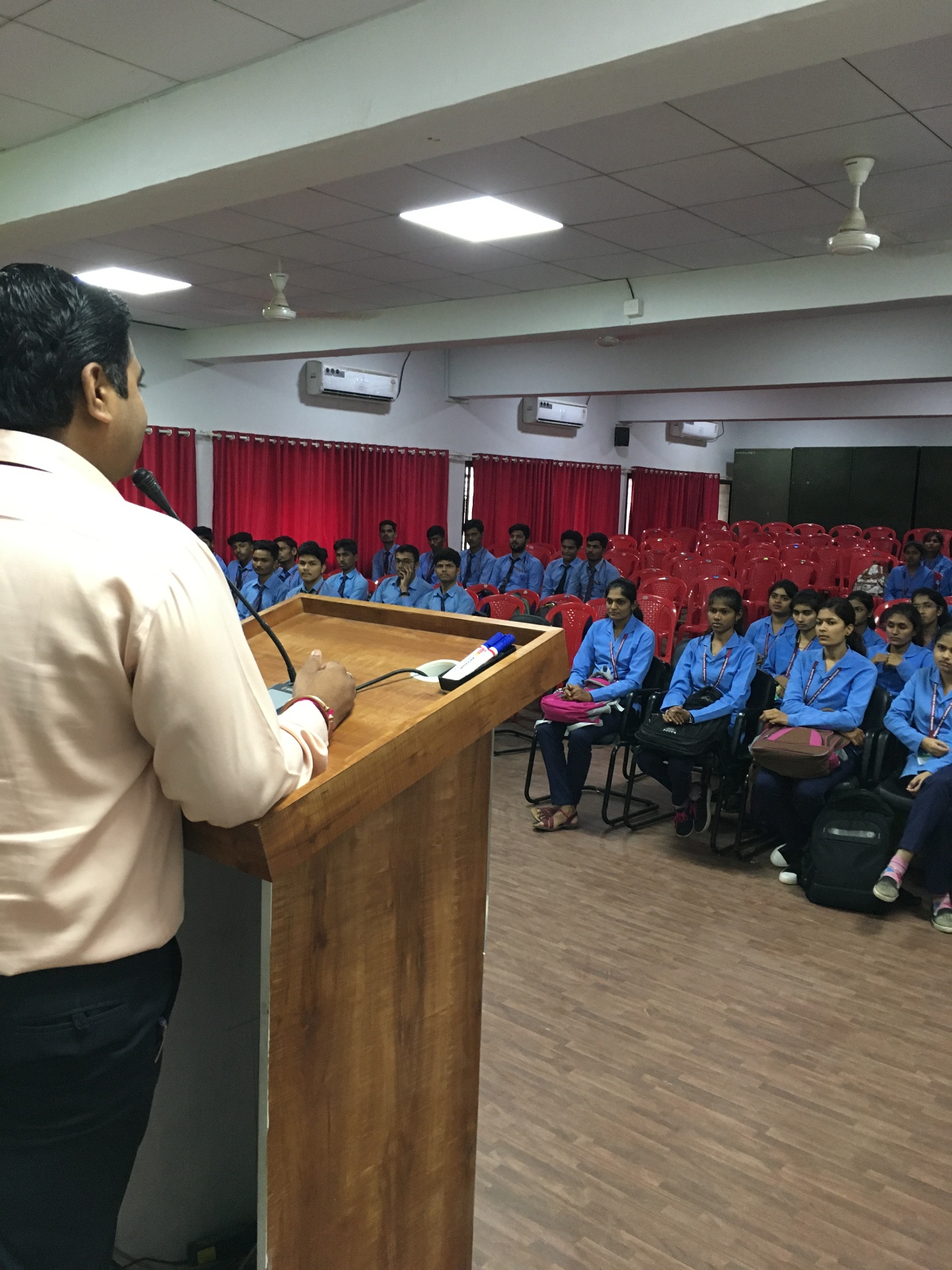 Addressing students at a departmental session