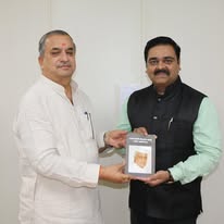 Felicitation with a dignitary — memento presentation