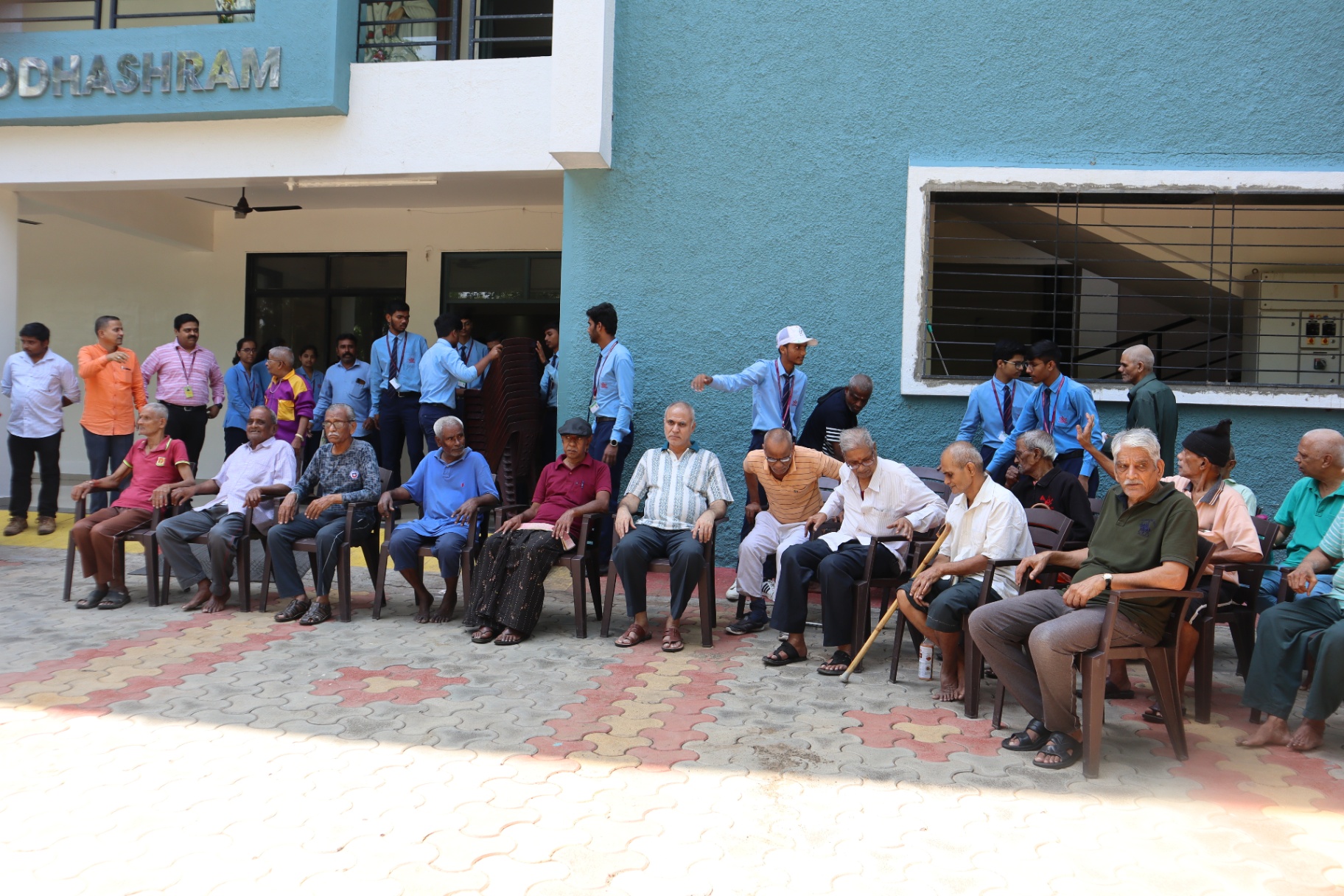 Residents seated outside Dwarkamai Vruddhashram
